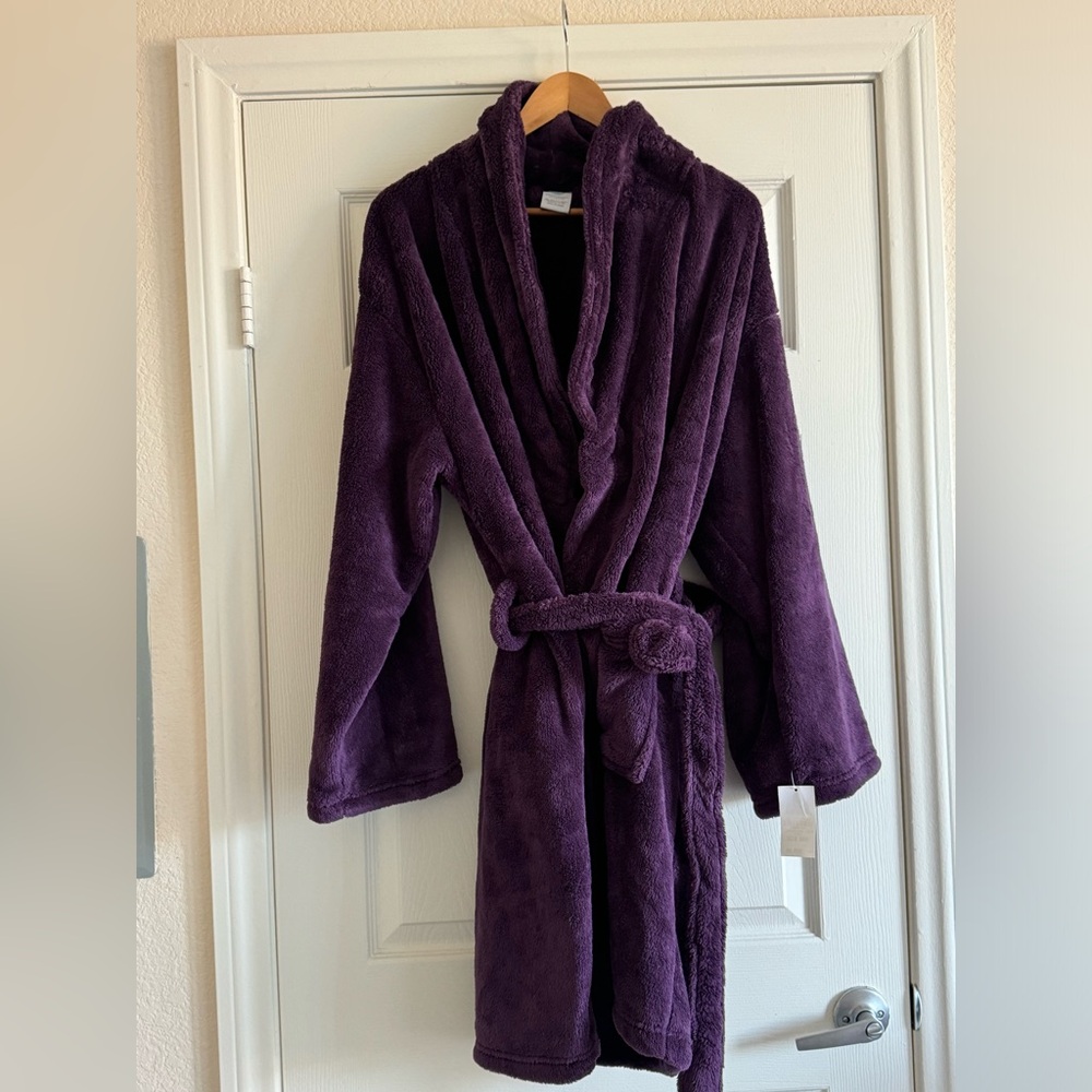Brand new, warm, fuzzy, cozy bath robe in a rich purple color. One size.